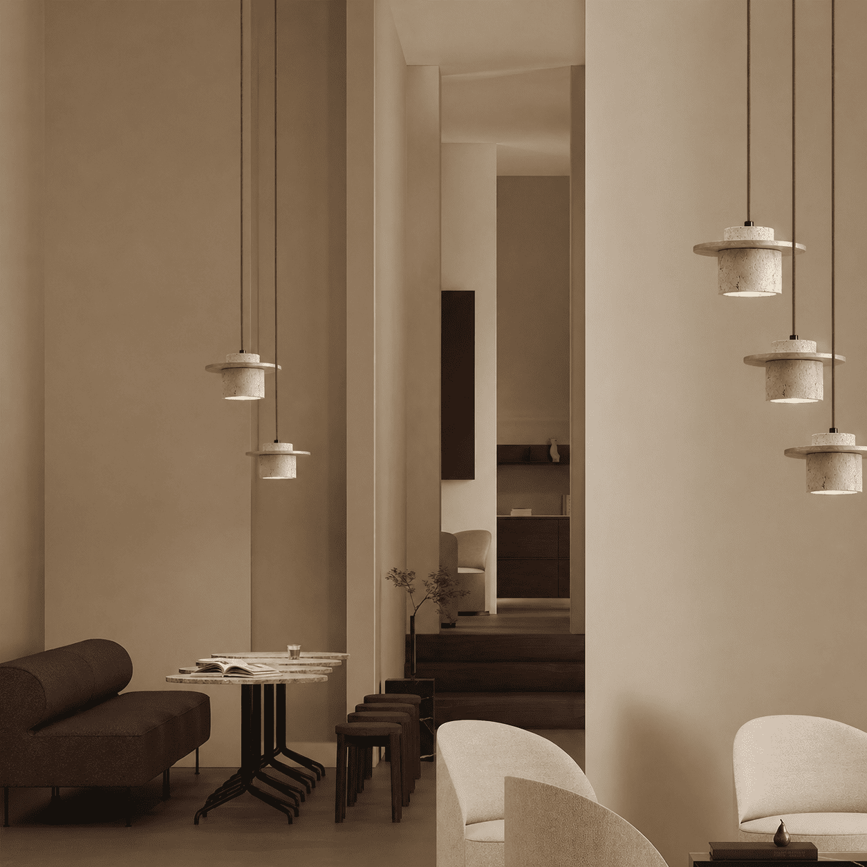 Aro stone pendant light installed beside a bed in a quiet neutral bedroom