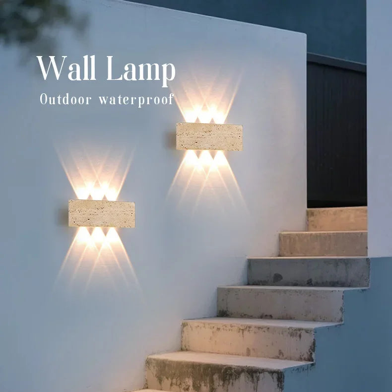Aure stone wall light feature image showing decorative up-and-down wall glow