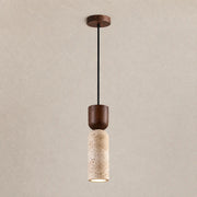 Auren stone pendant light with a slim textured stone shade, dark wood accent, and warm downward glow