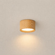 Auro wooden ceiling light with a round wood-finish shade and soft warm downward glow