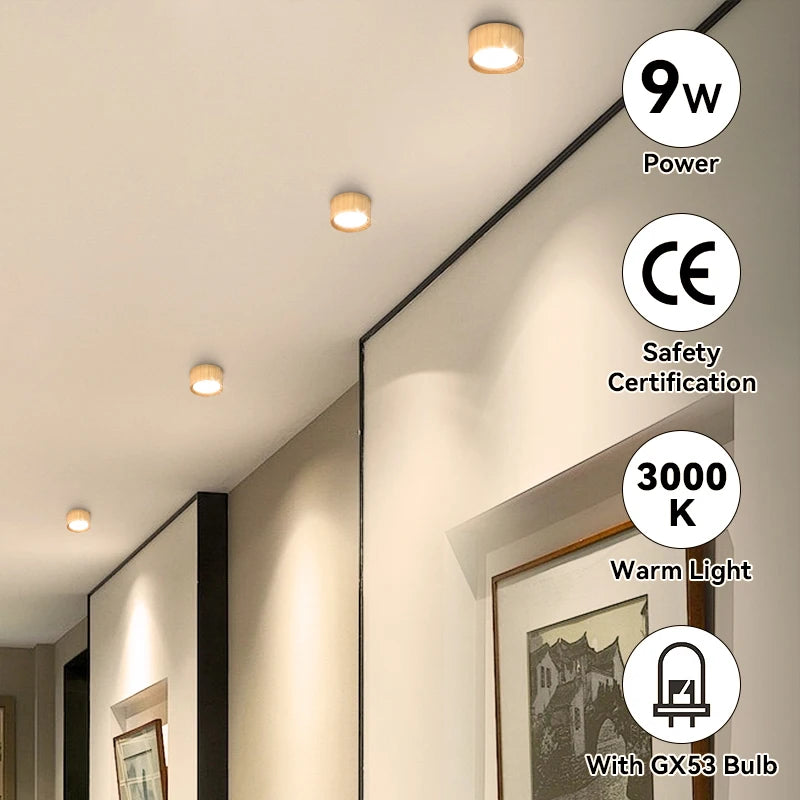 Auro wooden ceiling light installed in a bright modern room with soft warm overhead lighting