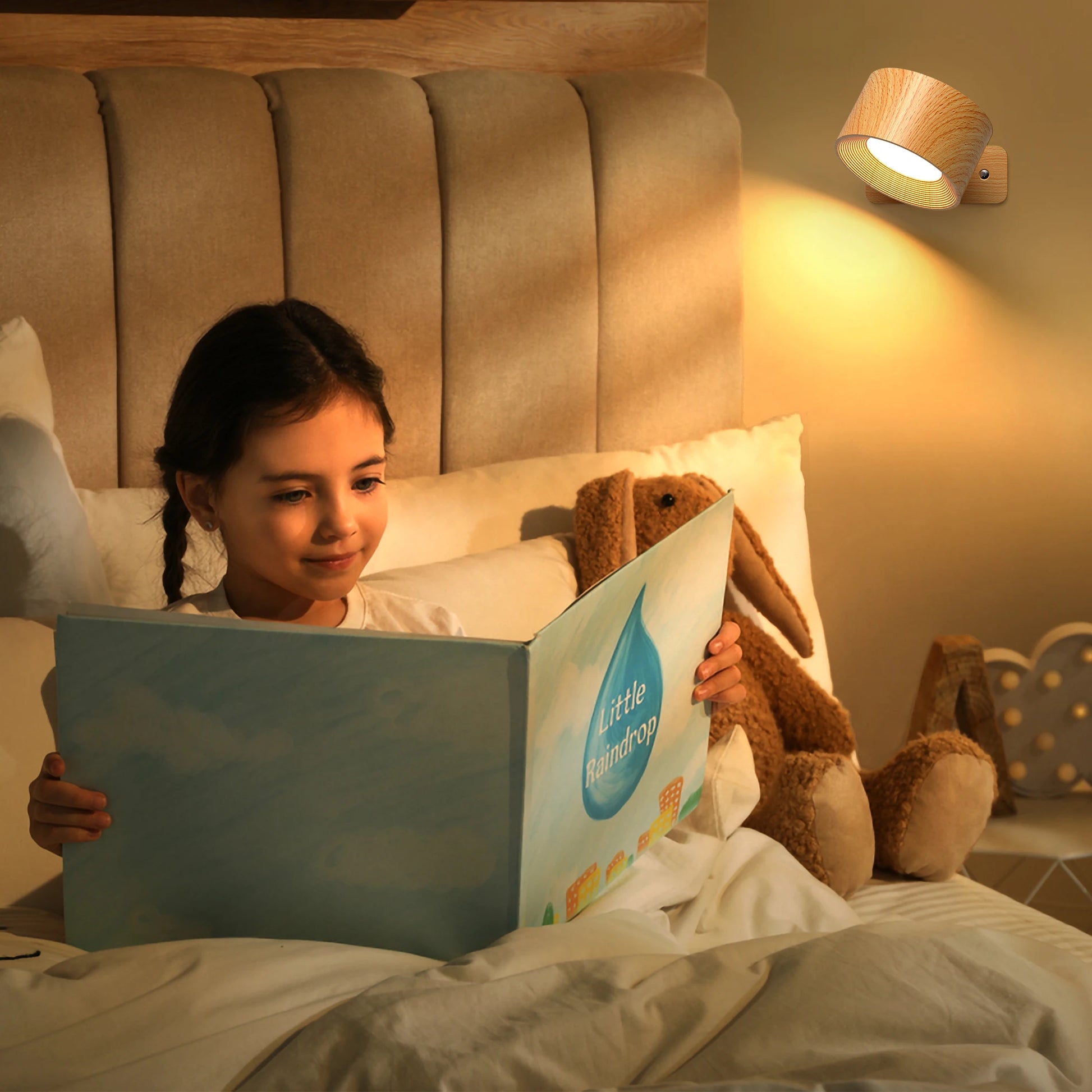 Avelis rotatable wall light creating warm focused light for bedside reading