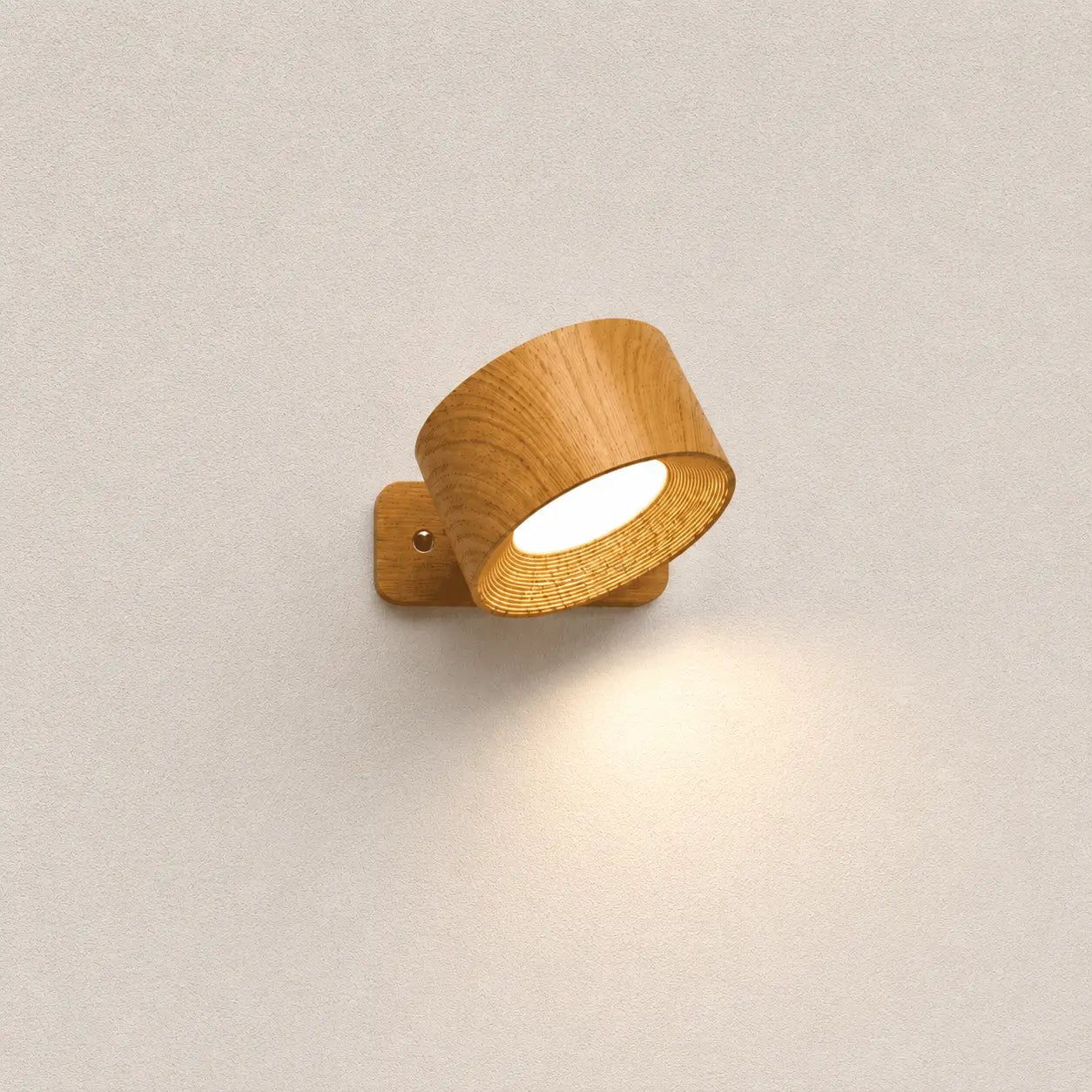 Avelis rotatable wall light with a natural wood finish, adjustable shade, and warm downward glow