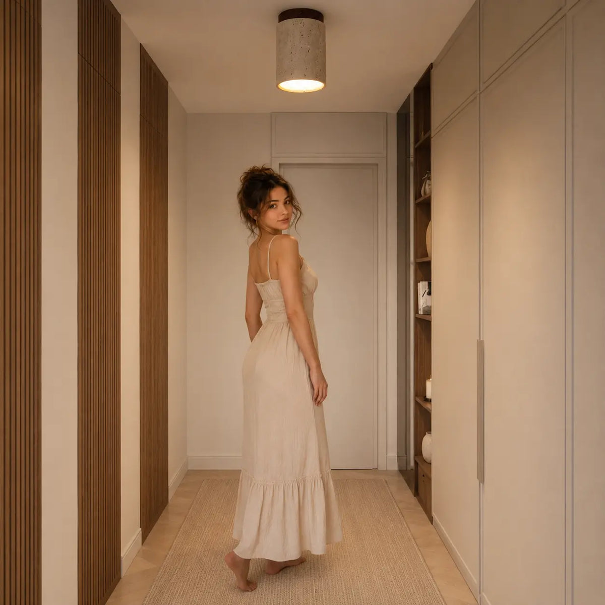 Aven stone ceiling light adding warm low-profile illumination to a modern entryway