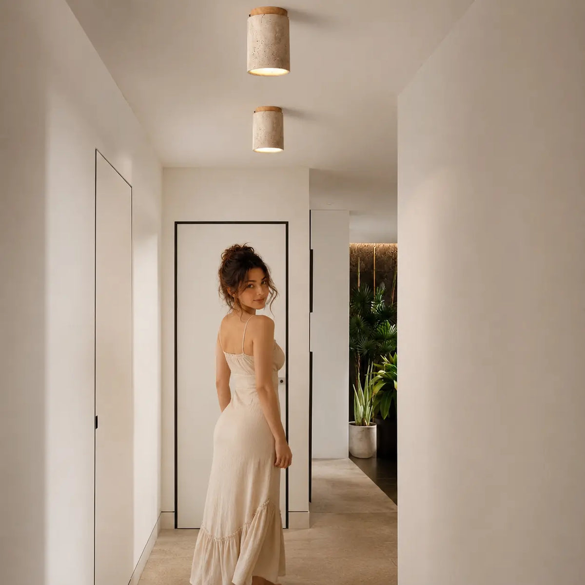 Aven stone ceiling light creating soft warm overhead light in a calm hallway