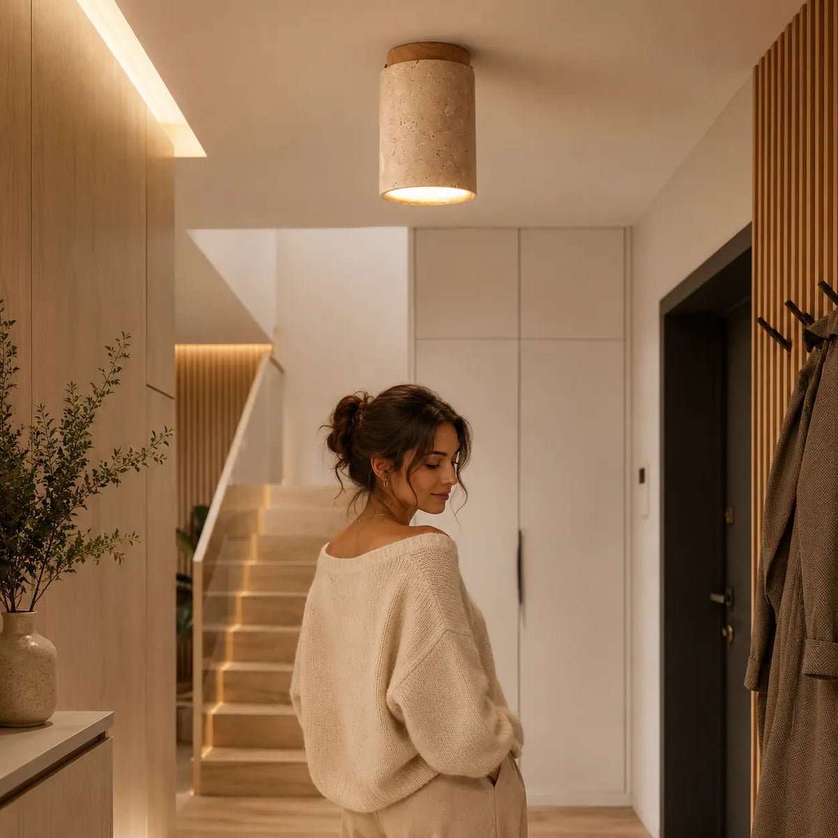 Aven stone ceiling light adding a calm warm mood to a hallway seating moment