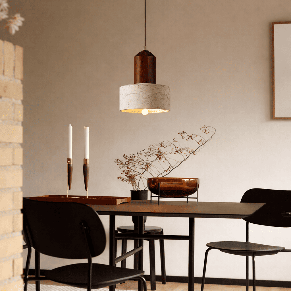 Eira stone pendant light bringing a quiet warm glow to a modern dining space