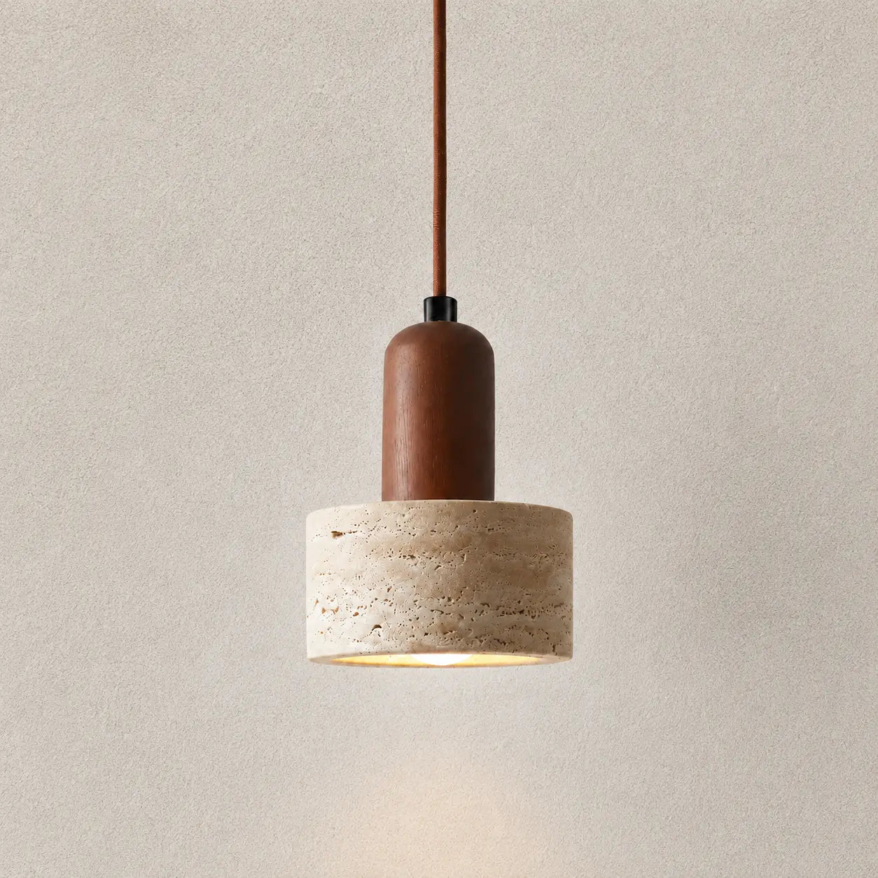 Eira stone pendant light with a textured stone shade and warm brown hanging cord