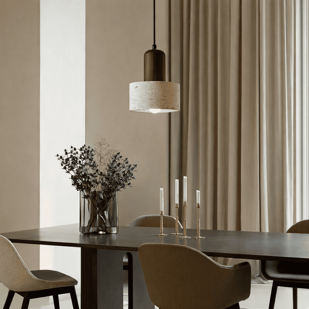 Eira stone pendant light creating warm focused light in a calm neutral interior
