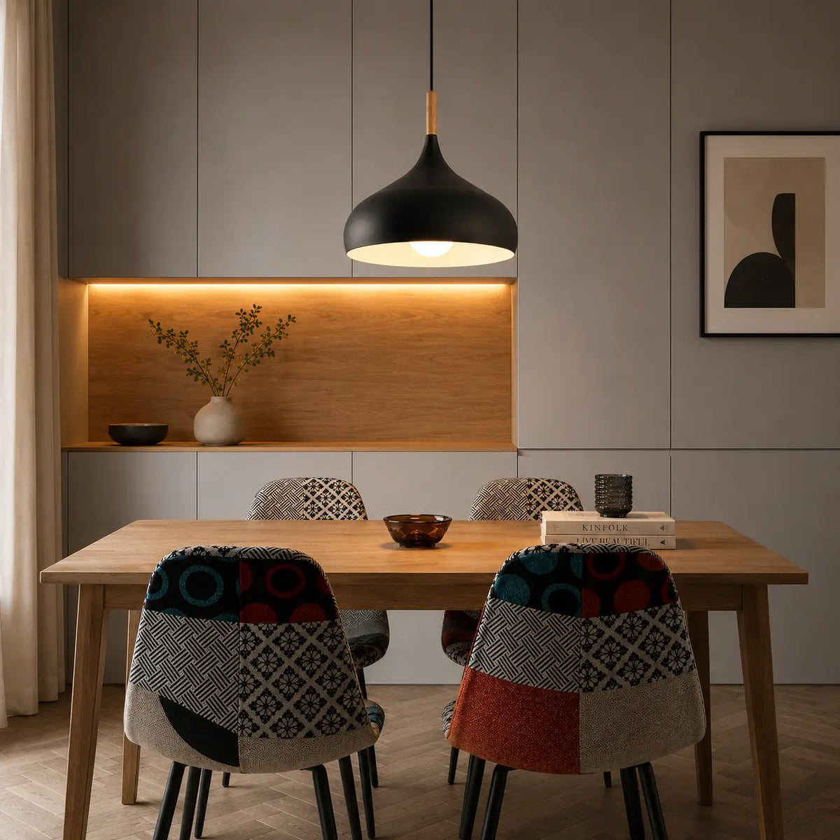 Lunara Nordic pendant light in black creating warm focused light above a dining table