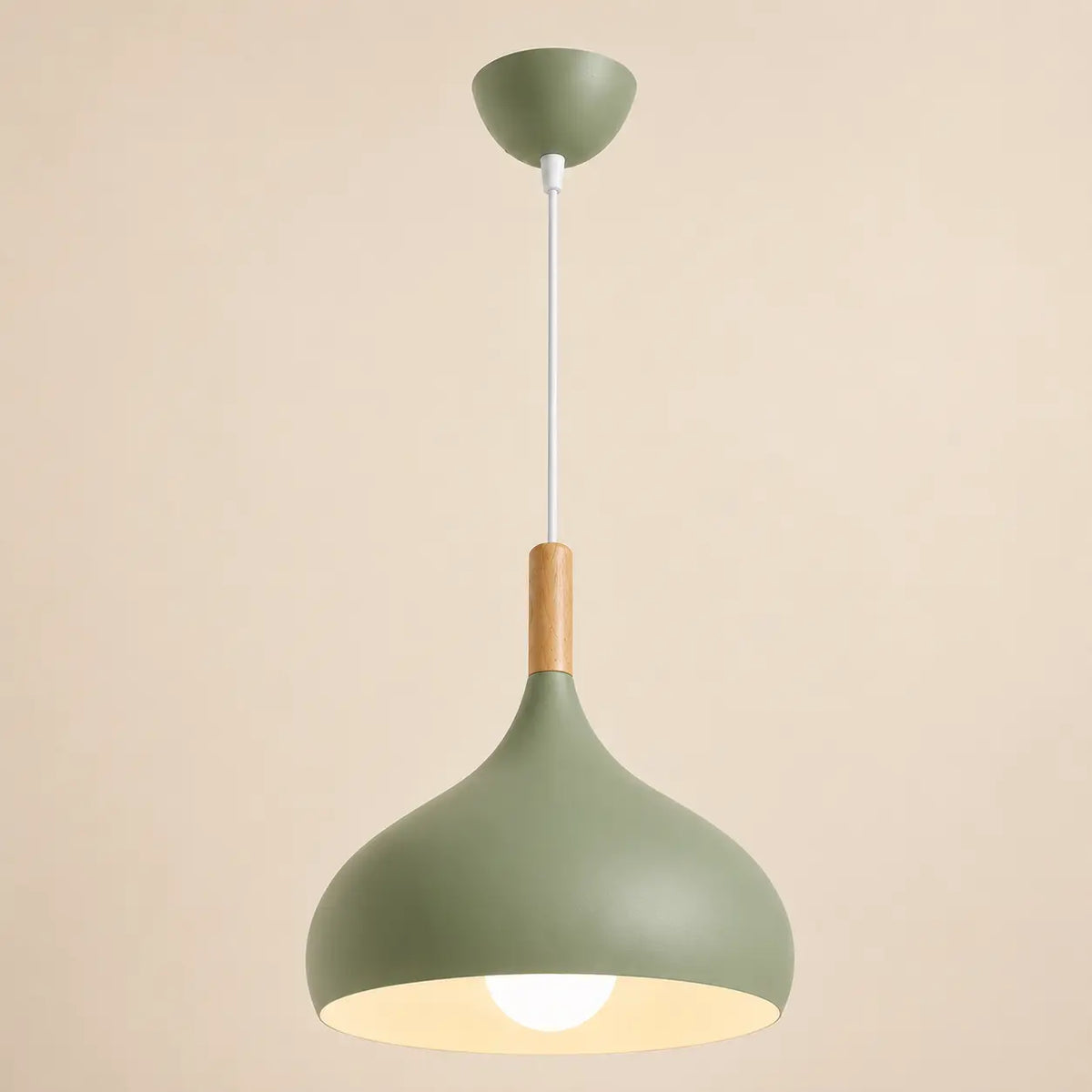 Lunara Nordic pendant light in green with a rounded shade and soft warm illumination