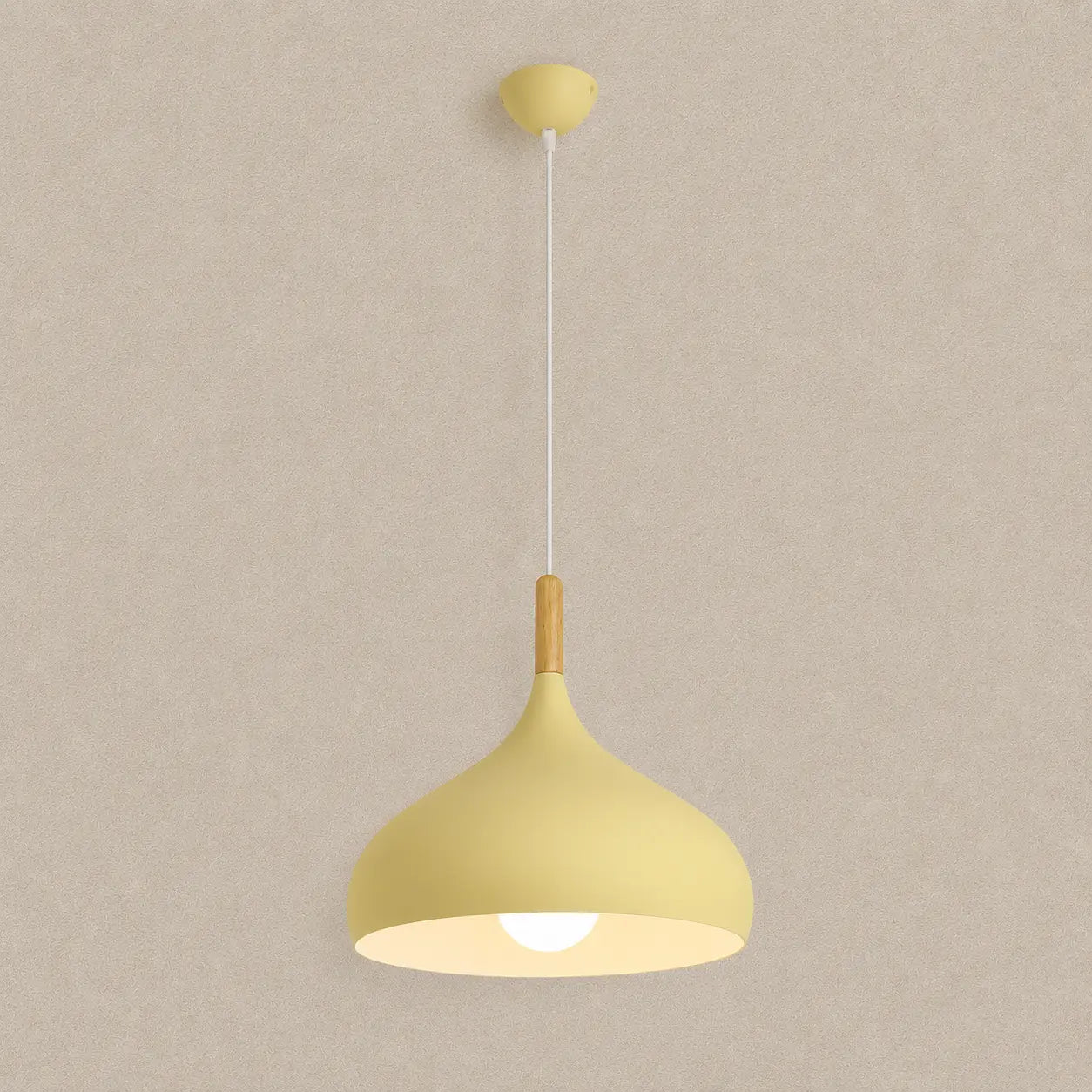 Lunara Nordic pendant light in yellow with a soft rounded shade and warm downward glow