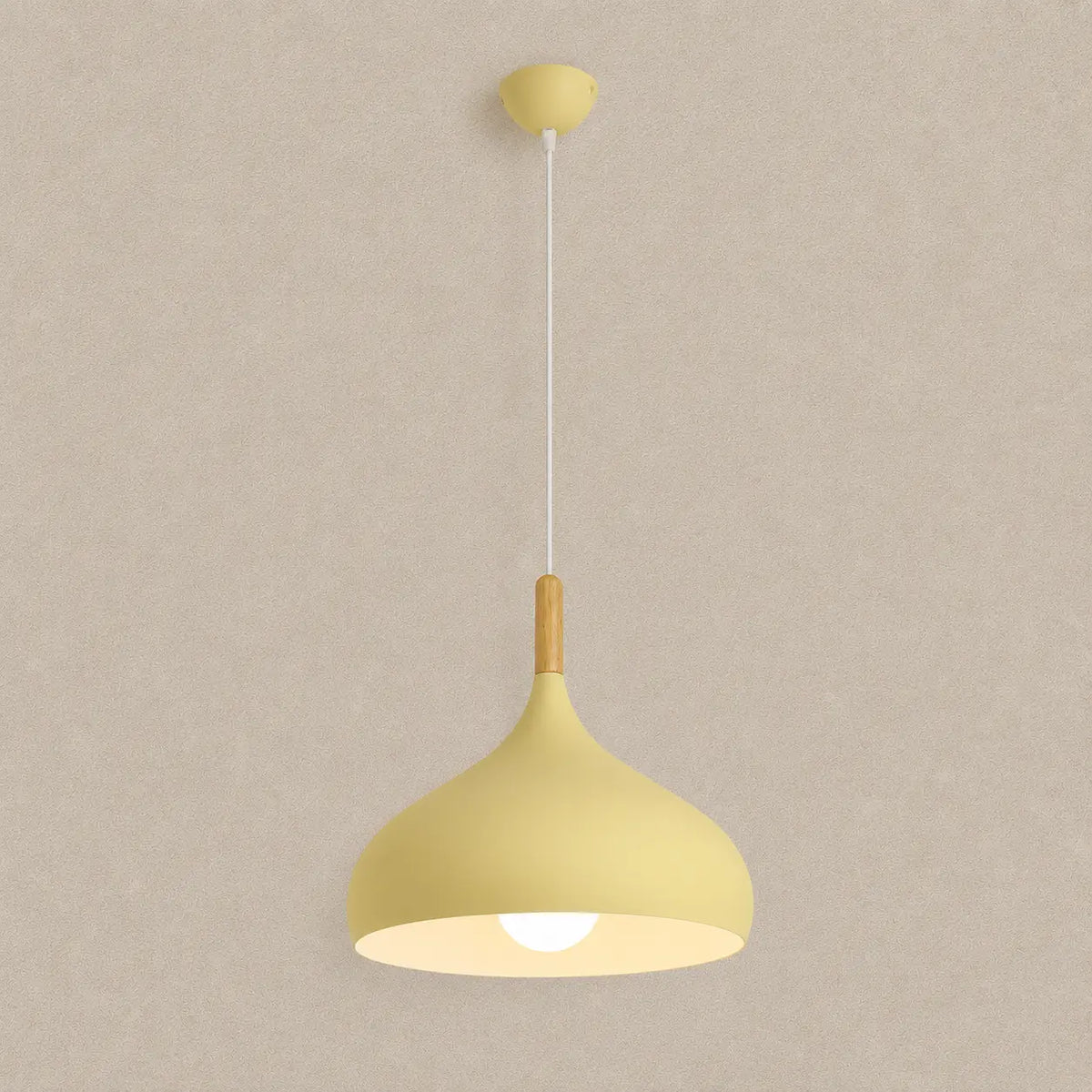 Lunara Nordic pendant light in yellow with a soft rounded shade and warm downward glow