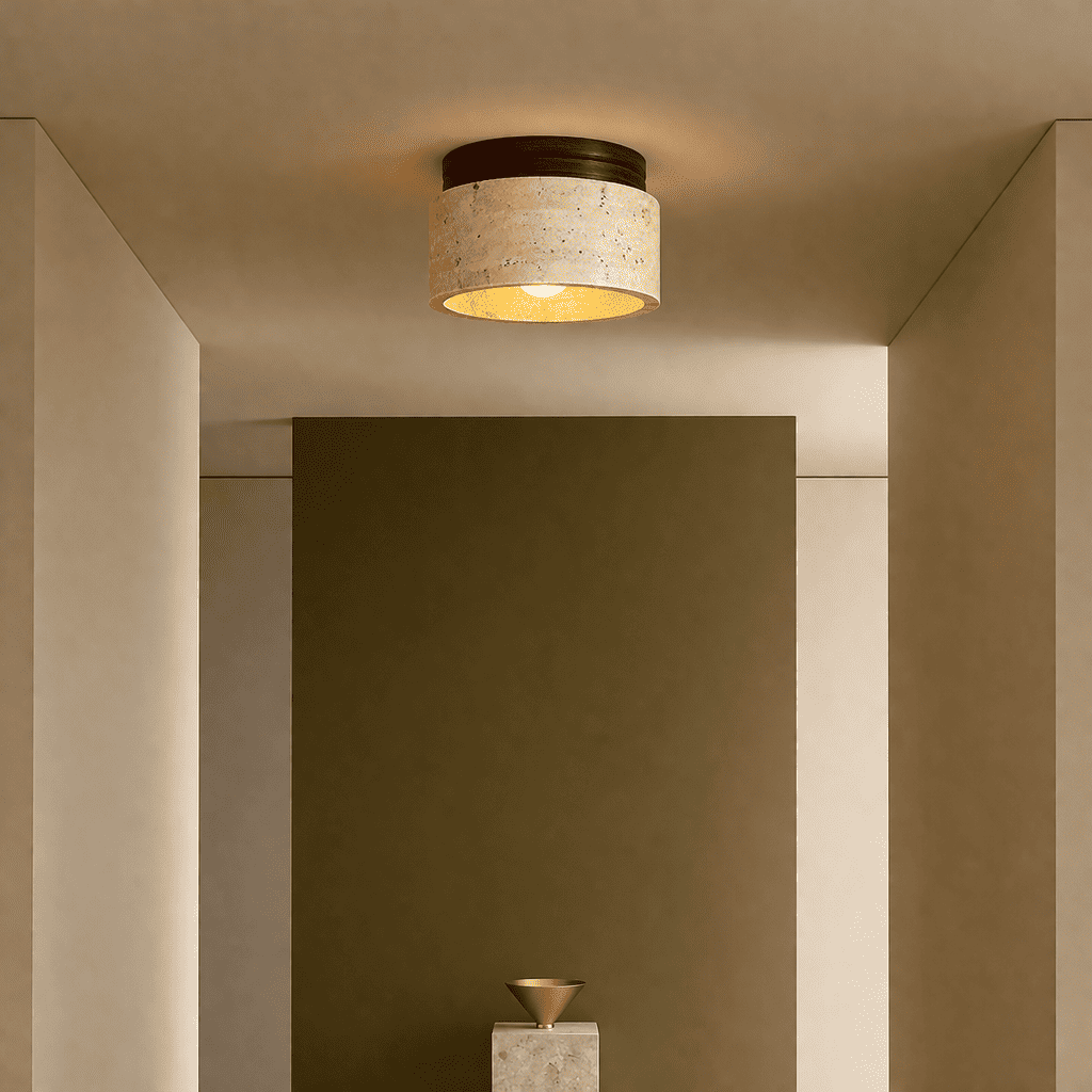 Mira stone ceiling light creating a soft warm glow in a calm modern entryway