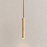Neri travertine pendant light with a slim vertical stone shade and warm downward glow