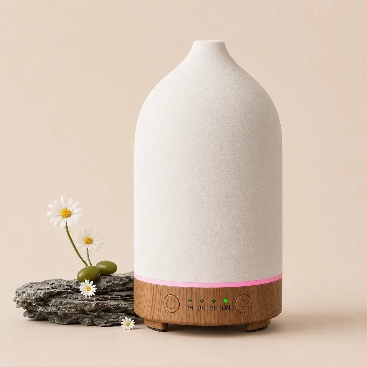Noctis ceramic diffuser styled with delicate flowers on a neutral tabletop