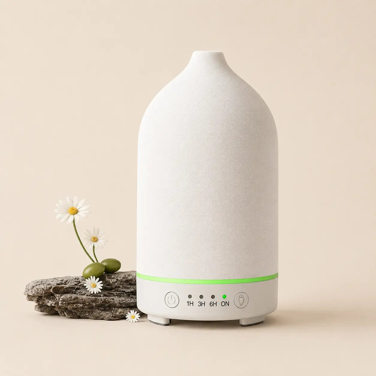 Noctis ceramic essential oil diffuser with a white sculptural form and natural wood base