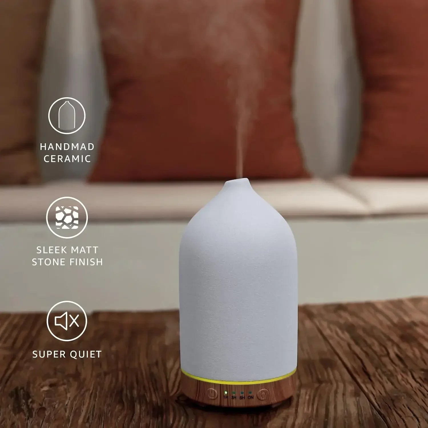Close-up of the Noctis ceramic diffuser with its warm natural wood base