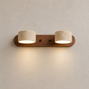 Oren travertine wall light with two textured stone shades and a warm wood mounting bar
