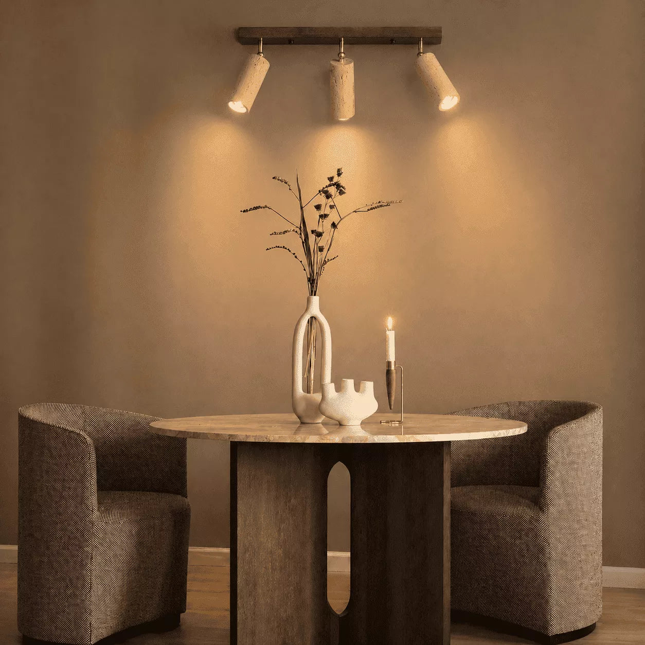 Rhea stone ceiling light creating warm overhead illumination in a quiet entryway