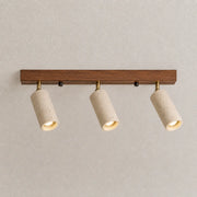 Rhea stone ceiling light with three adjustable stone-finish spotlights and a warm wood mounting bar