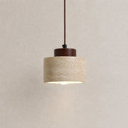 Selo stone pendant light with a textured stone shade, dark wood top detail, and warm downward glow