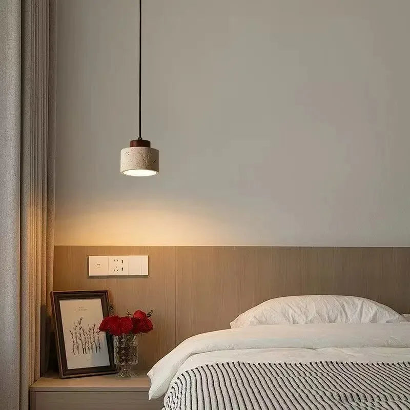 Selo stone pendant light adding a quiet warm accent near a bright window seat