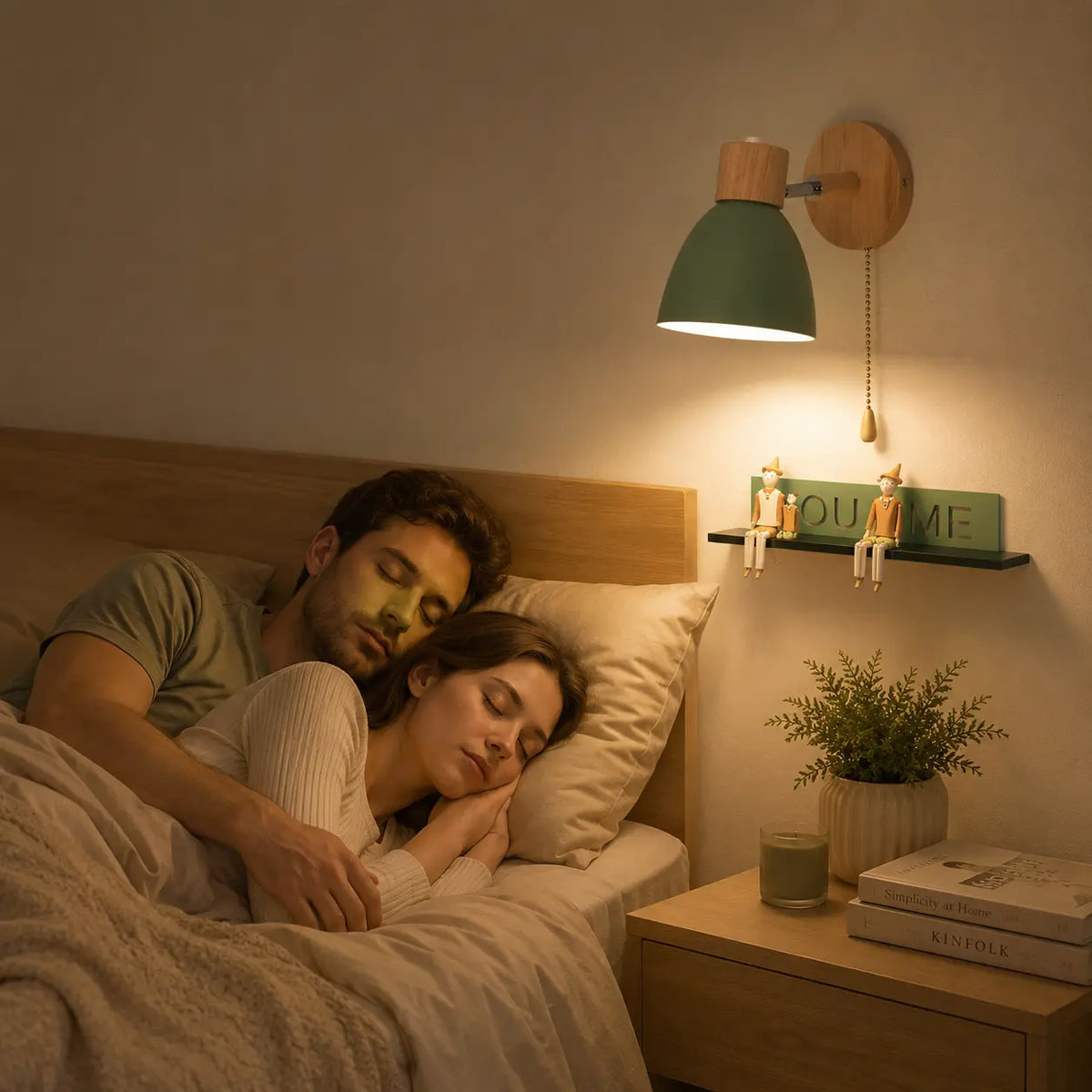 Solenne macaron wall sconce in green adding soft warm light to a cozy bedroom