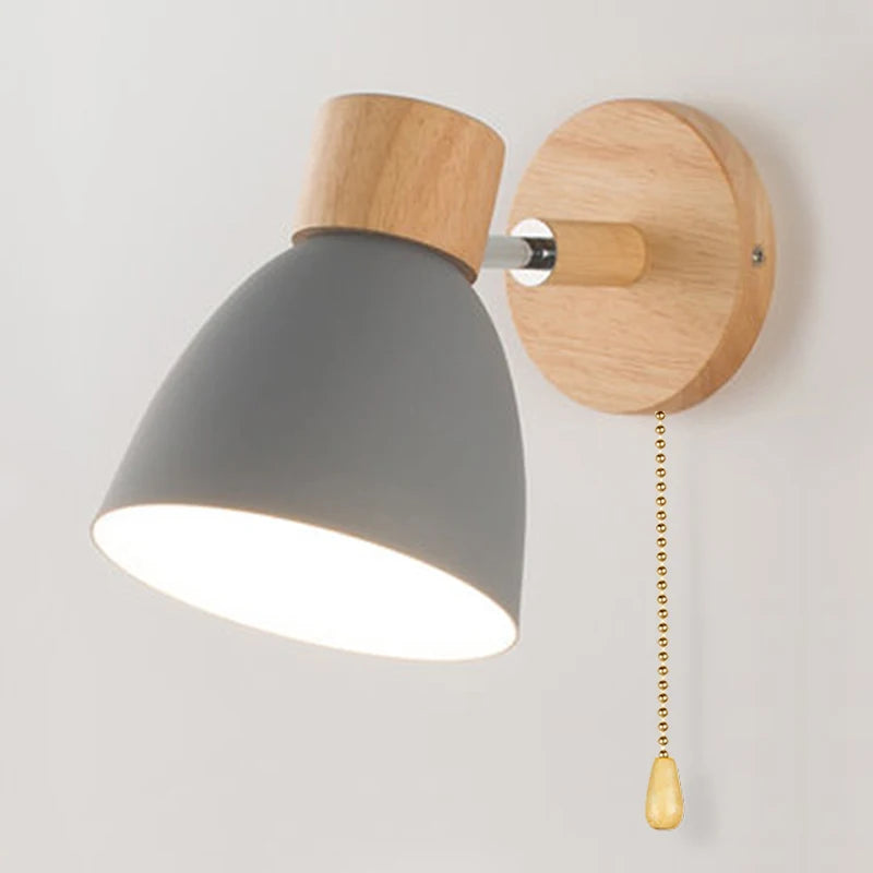 Solenne macaron wall sconce in white showing the pull cord and adjustable wall-mounted design