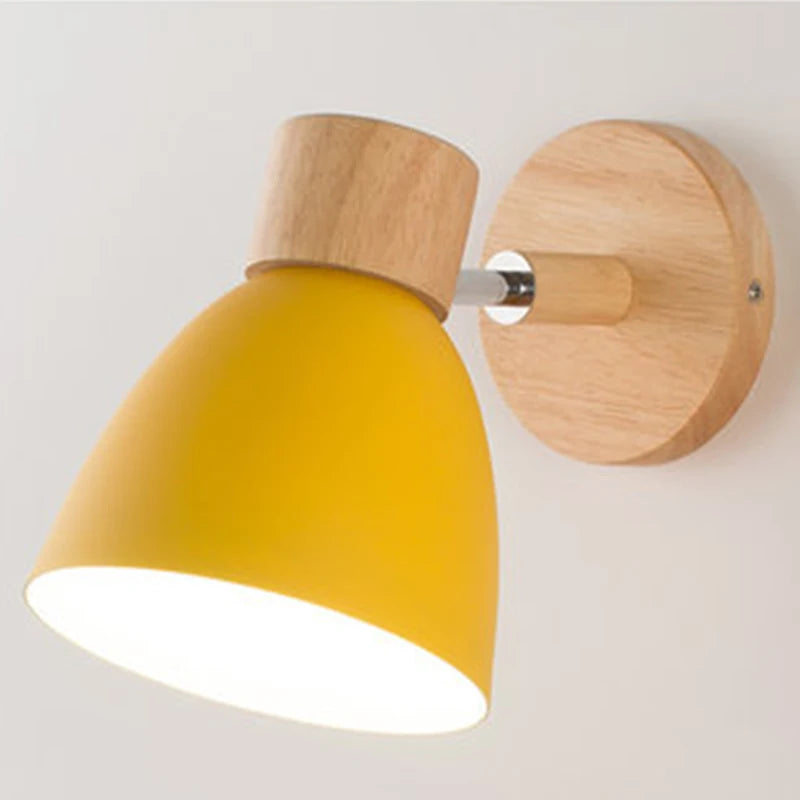 Solenne macaron wall sconce in yellow with adjustable shade and natural wood wall mount
