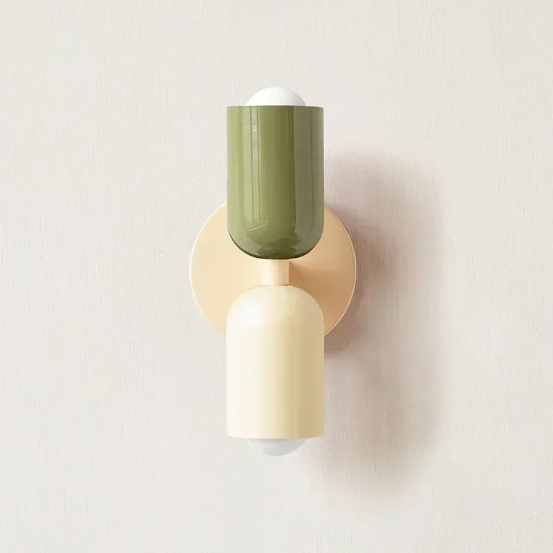 Solvi macaron wall light in green and natural tones with a rounded shade and soft warm glow