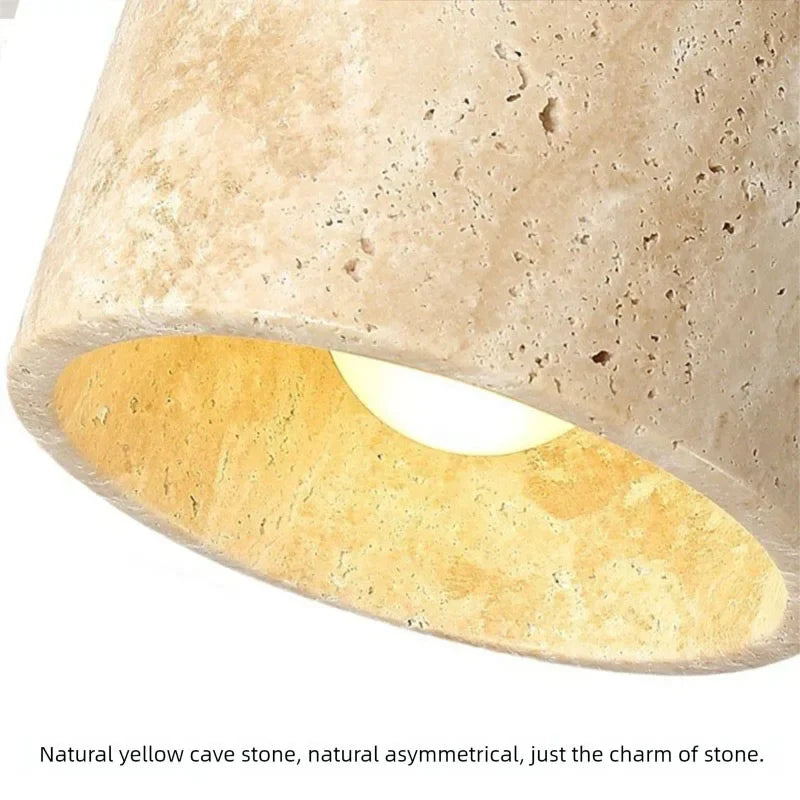 Close-up of the Velor stone wall light textured shade with warm diffused illumination