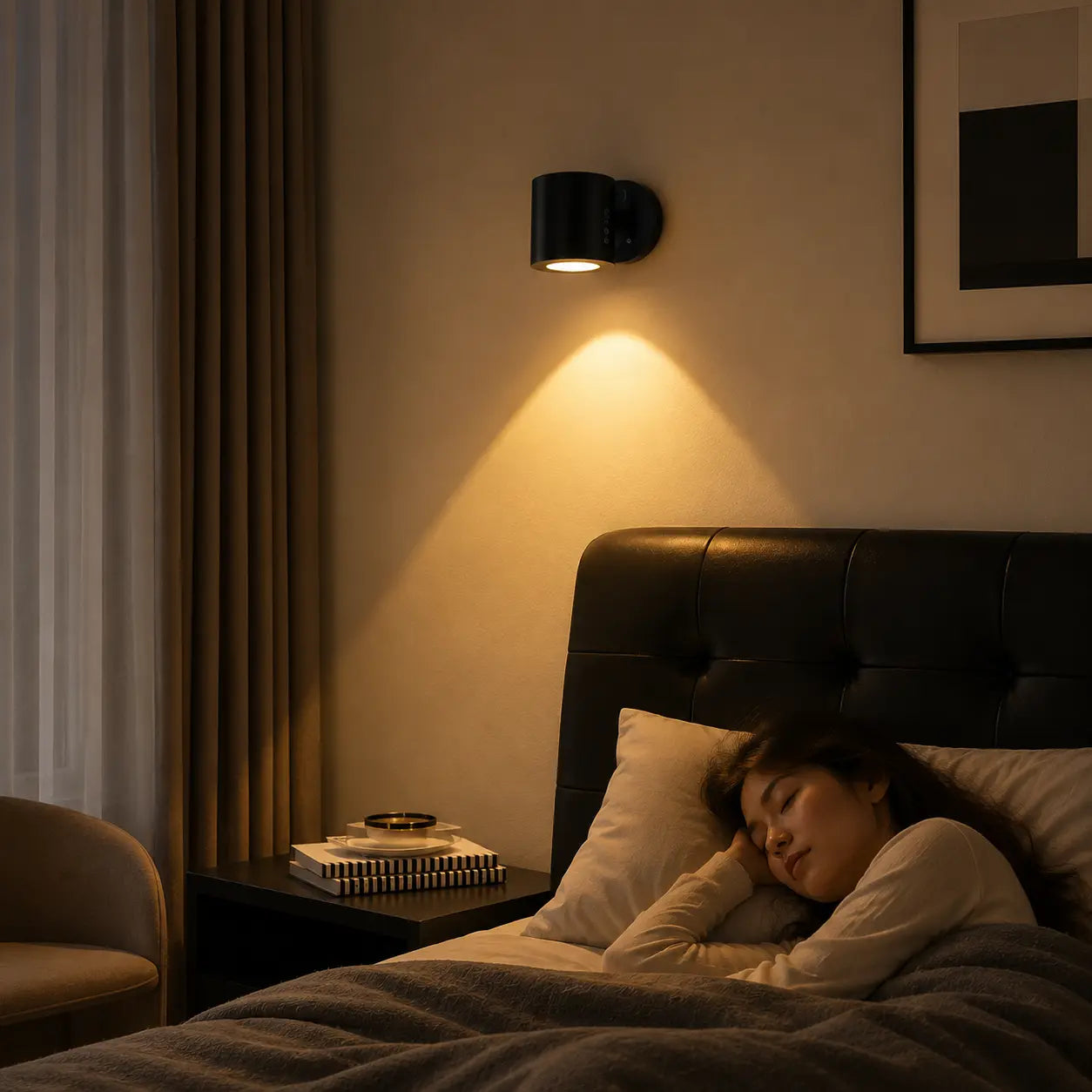 Veyra magnetic wall light creating warm focused light beside a bedroom bed