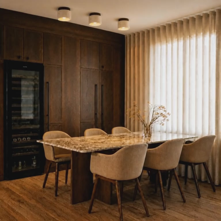 Video of the Mira stone ceiling light adding warm low-profile overhead light to a calm corridor